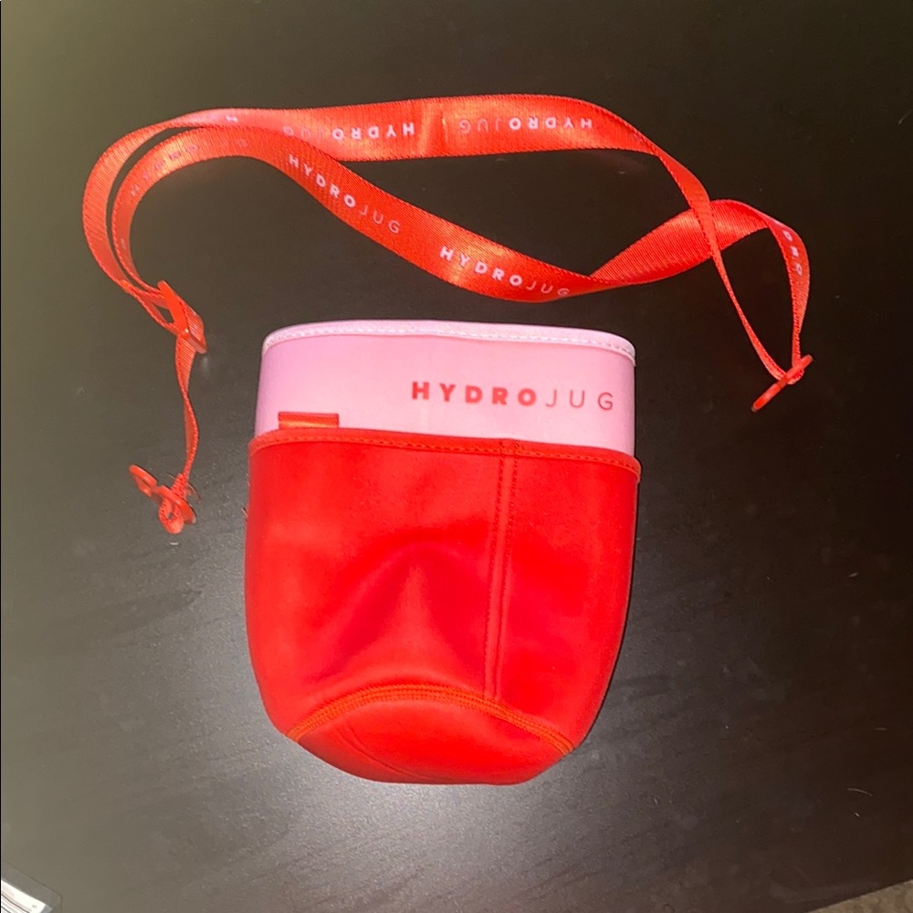 New in bag HydroJug Red and Pink Bottle Sleeve with Strap
